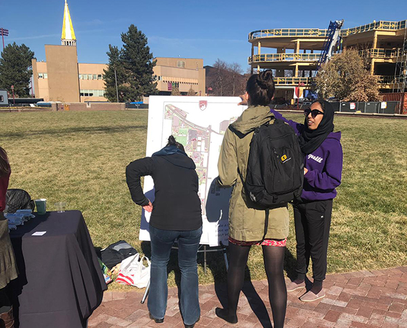 people around Map outside on campus